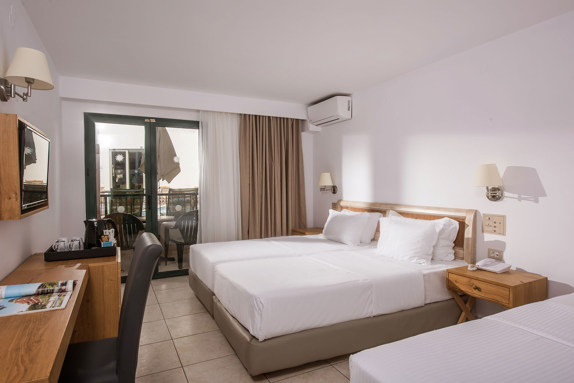 Standard room with double bed and extra bed, private balcony and workspace at Gouves Water Park Holiday Resort 