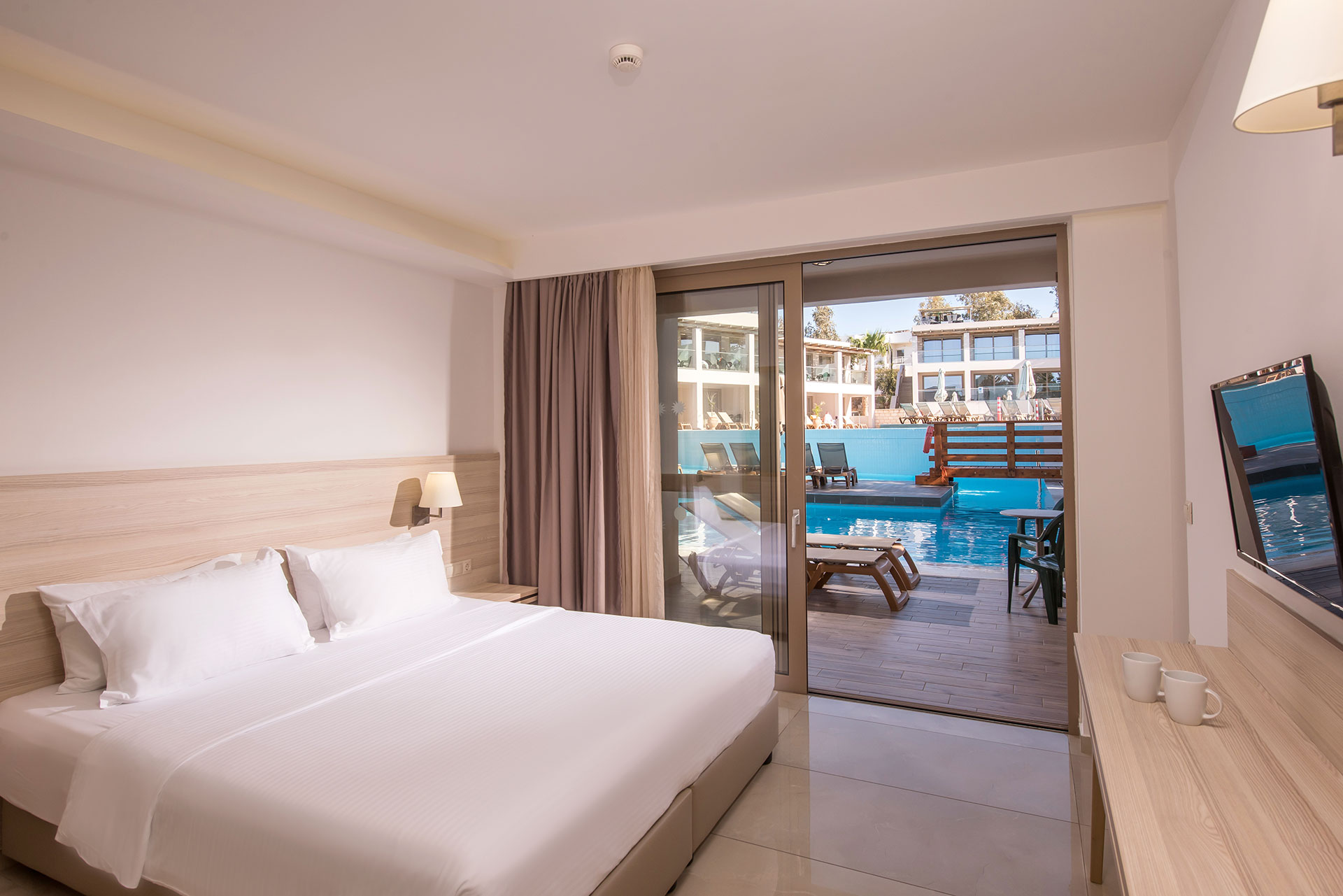 Family Room Swim Up with poolfront terrace and direct access to the shared pool at Gouves Water Park Holiday Resort